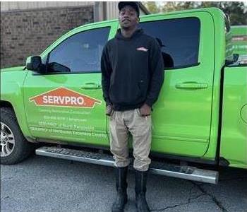 SERVPRO employee next to service truck